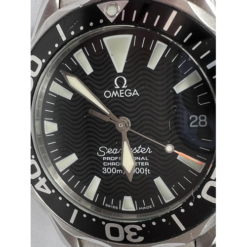 741 - OMEGA: a circa 2000's Omega Seamaster professional chronometer with black wave dial and black bezel ... 