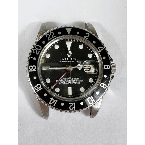 742 - ROLEX GMT-MASTER: A Rolex Perpetual Date GMT-Master black dial and bezel gentleman's wristwatch with... 