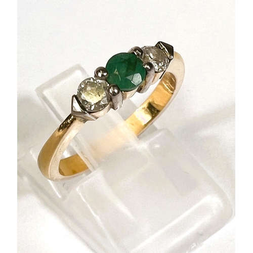 746D - A yellow metal 3 stone emerald and diamond ring, unmarkd (tests as 9ct+) 3.7gm