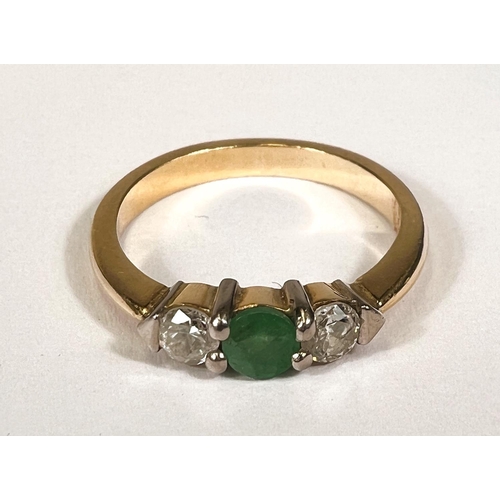 746D - A yellow metal 3 stone emerald and diamond ring, unmarkd (tests as 9ct+) 3.7gm