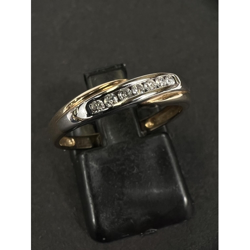 746B - A seven stoe diamond half ternity ring stamped '375'; a 9 carat hallmarked gold ring set with7 clear... 