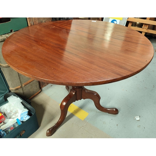 787 - A mahogany circular tilt top table with turned column and tripod legs