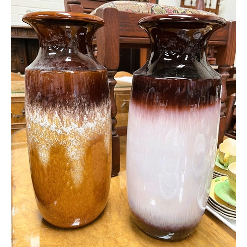 473 - A pair of West German stoneware vases, one yellow and brown and one brown and pink, height 41cm