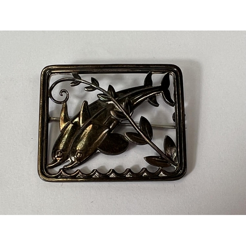 670 - A Georg Jensen brooch with 2 dolphins