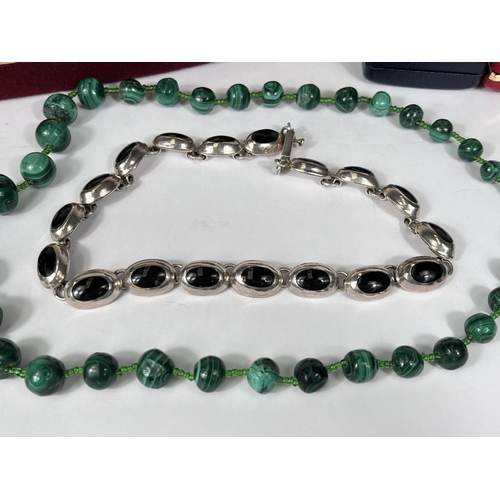 713A - A malachite bead necklace; a Mexican silver and onyx necklace; a hallmarked silver Scottish brooch; ... 