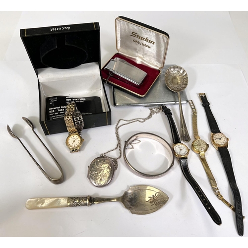 739C - A silver locket and bangle; other ladies watches etc.