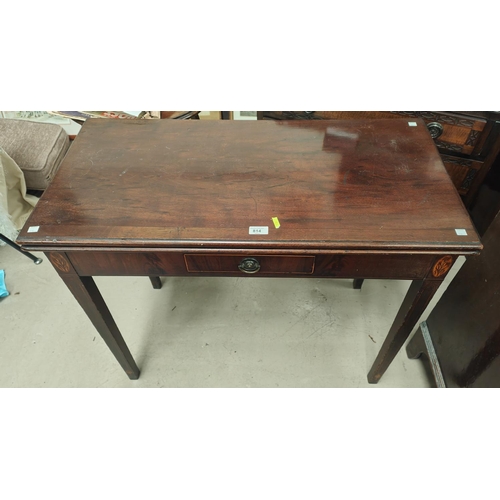 814 - An early 19th century mahogany fold over card table