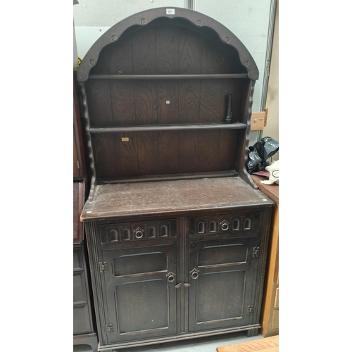 831 - An oak reproduction Dutch dresser with 3 shelves, 2 height and double cupboard/drawers, width 94cm