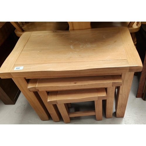 898 - A light oak nest of 3 tables