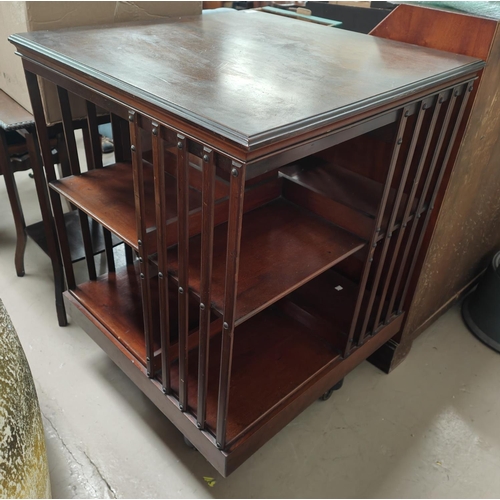 932 - A Large early 20th century mahogany revolving bookcase by 'Maple & Co' height 94x68x68cm