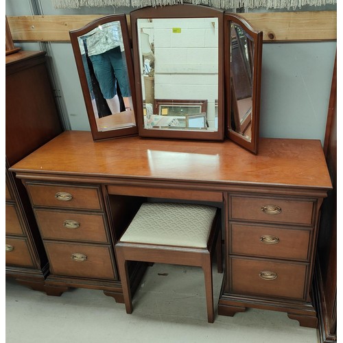 929 - A Stag cherry wood dressing table with stool, a matching wardrobe,, and headboard 