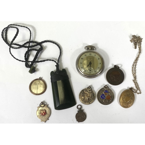 661 - An open faced, keyless pocket watch by Westclox; a gold plated locket; a jade coloured axe shaped pe... 