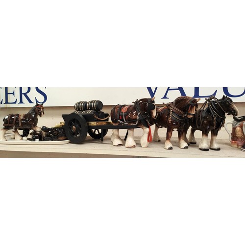 482C - A collection of pottery Shire horses of varying sizes