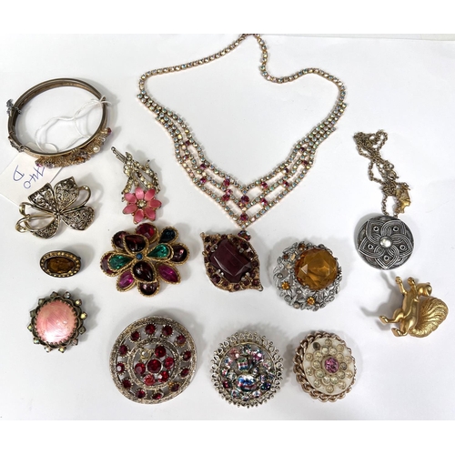 740D - A selection of costume brooches etc. with coloured stone settings.