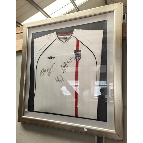 66A - A framed signed England Football Shirt, signatures unclear  , Star Wars VHS, Chinese stress bal... 