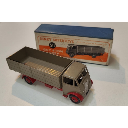 402 - DINKY SUPERTOYS: 511 Guy 4-Ton Lorry in tan with red highlights, red hubcaps and blue box with orang... 