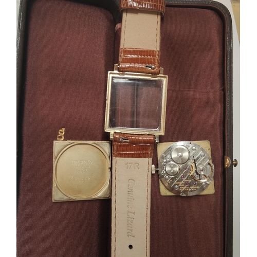 694 - TIFFANY & CO WATCH: a c 1940's 14ct gold cased gent's dress watch marked Tiffany & Co, on me... 