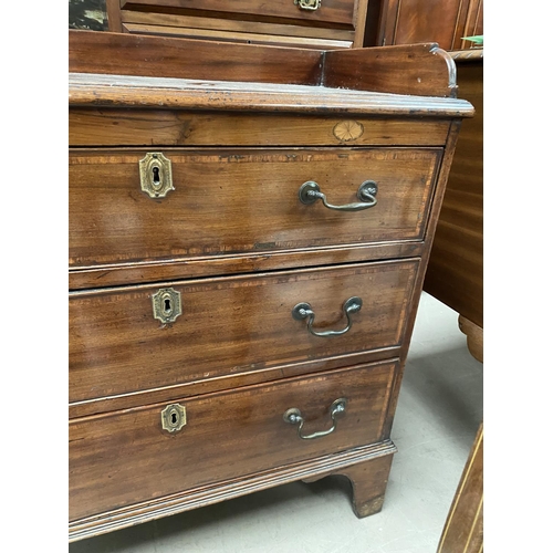 827 - A 19th century Sheraton style bachelors chest of 3 drawers, inlaid and crossbanded, with raised gall... 