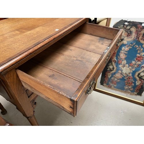 917 - A Victorian pair of ladies and gents spoon back chairs in carved walnut on knurled feet and cas... 