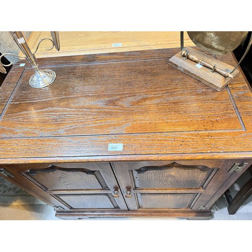 869 - An 18th century style distressed oak hostess trolley in the manner of Titchmarsh & Goodwin enclo... 