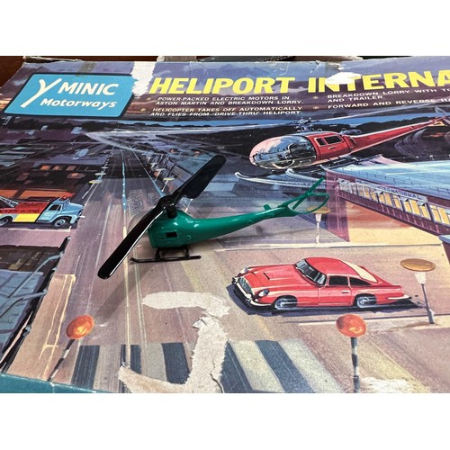 431 - A Minic Motorways Heliport International set with box, three vehicles track, three other diecast veh... 