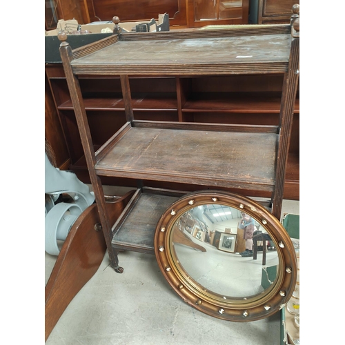 1035 - An Edwardian mahogany music cabinet with fall front music drawers; An oak three tier trolley, a gilt... 