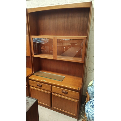 1006 - A mid 20th century teak wall unit, double glazed cupboard above, double drawers and cupboard below, ... 