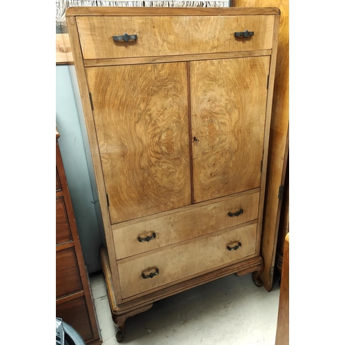 1014 - An Art Deco walnut tallboy with top drawer, central cupboard and two drawers below, 137 x 76cm and a... 