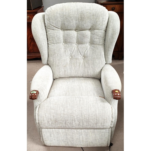 1044 - An electric easy chair in cream fabric button back