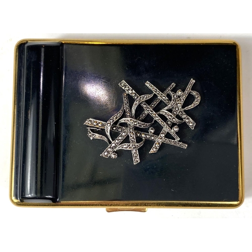 25 - A vintage Kigu of London compact with lipstick case, black enamel with diamante decoration in origin... 