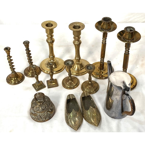 34 - An EPNS hot water jug; 5 pairs of brass candlesticks; other metalware