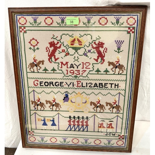 38 - A George III coronation sampler, framed and glazed; an Egyptian picture; two modern abstract oils