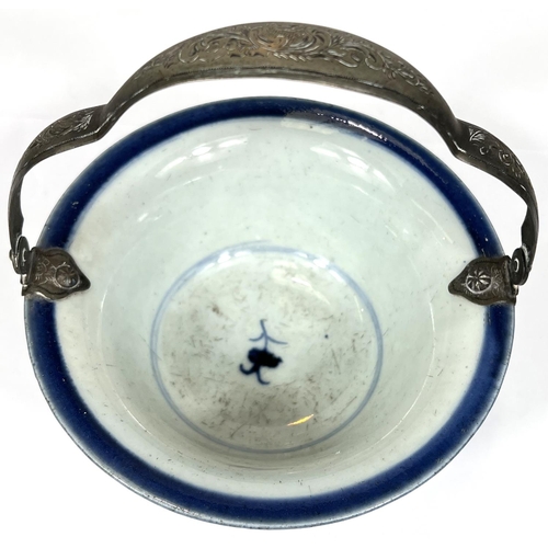 403 - A Chinese 18th century blue and white bowl with floral decoration to the outside, mark to base with ... 