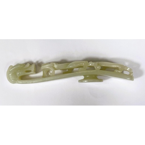 431 - A large Chinese jade coloured hardstone belt buckle with dragon decoration length 13cm