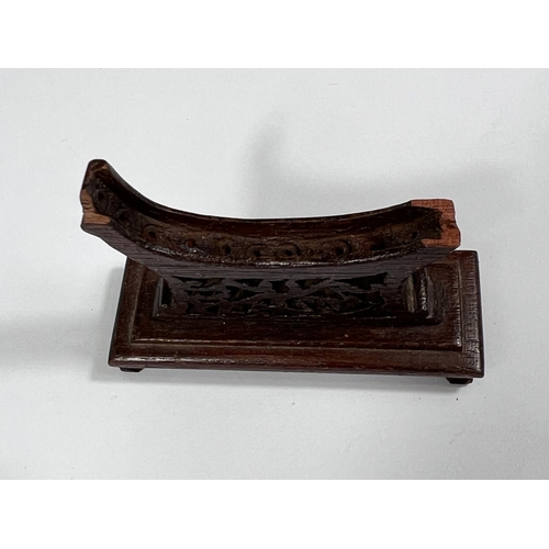 432 - A Chinese jade coloured hardstone carving of a fish on associated stand, length 9cm