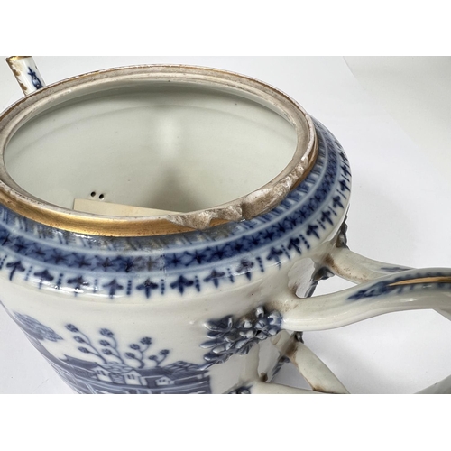 435 - A Chinese export blue and white teapot with over twisted handle, gilt and blue and white decoration ... 