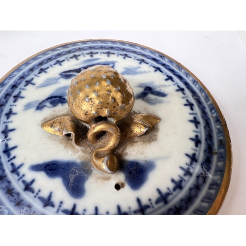 435 - A Chinese export blue and white teapot with over twisted handle, gilt and blue and white decoration ... 