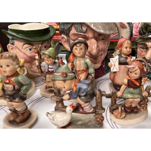 477 - A collection of Hummel Geobels figures, character jugs etc 