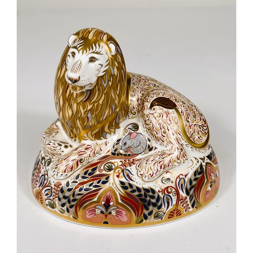 491 - A Royal Crown Derby paperweight 'Lion' LX reclining, with gold back stopper