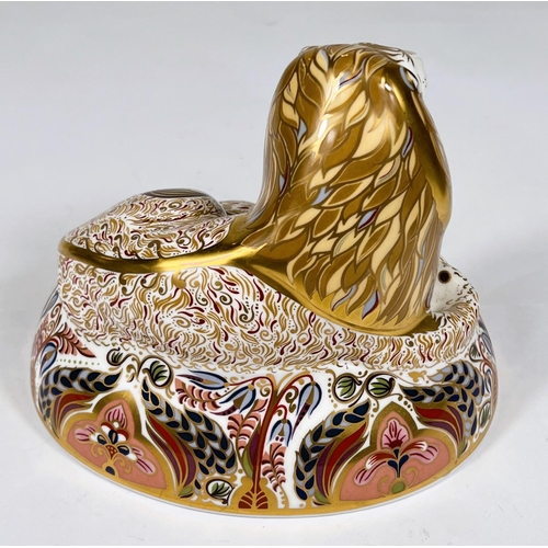 491 - A Royal Crown Derby paperweight 'Lion' LX reclining, with gold back stopper