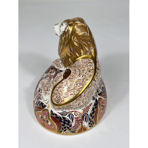 491 - A Royal Crown Derby paperweight 'Lion' LX reclining, with gold back stopper