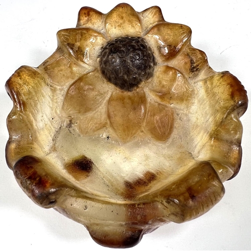 534 - A brown glass small trinket dish with relief flower, signed G. Argy-Rousseau, diameter 9cm