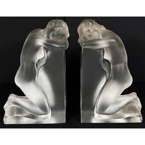 537 - A pair of Lalique frosted glass bookends with kneeling nude females, signed 'Lalique France' in scri... 