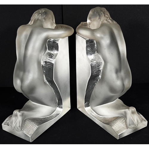 537 - A pair of Lalique frosted glass bookends with kneeling nude females, signed 'Lalique France' in scri... 