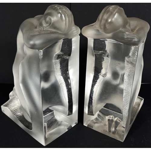 537 - A pair of Lalique frosted glass bookends with kneeling nude females, signed 'Lalique France' in scri... 