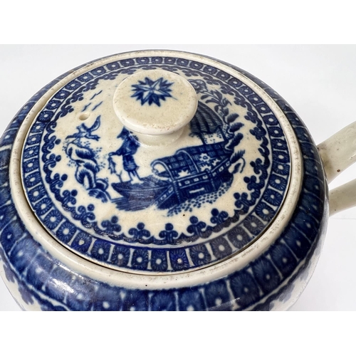 542 - A First Period Worcester blue & white teapot of ovoid form, decorated in the 'Fisherman & Co... 