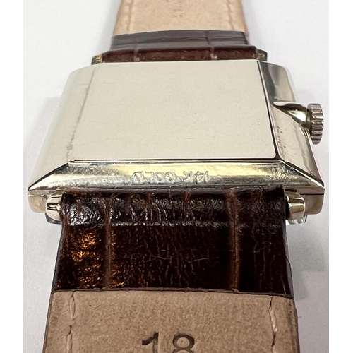 617 - OMEGA: a c.1962 manual watch with square black dial, silver hands and batons, stamped 14K GOLD (whit... 