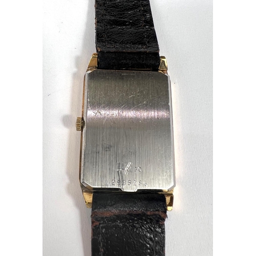 619 - UNIVERSAL GENEVE: a c.1970's watch with rectangular black dial, gold hands and batons, stamped 54213... 