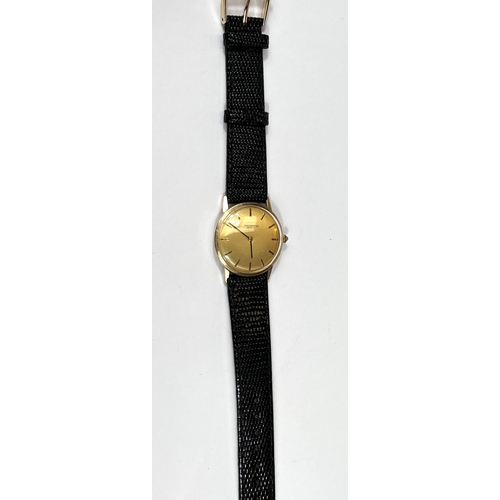 619A - UNIVERSAL GENEVE: a c.1960 gold Swiss watch with gold dial, black hands and black/gold batons, blue ... 