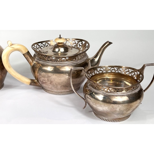 621 - A hallmarked silver 4 piece tea set of baluster form with pierced rims and gadrooned borders, ivory ... 